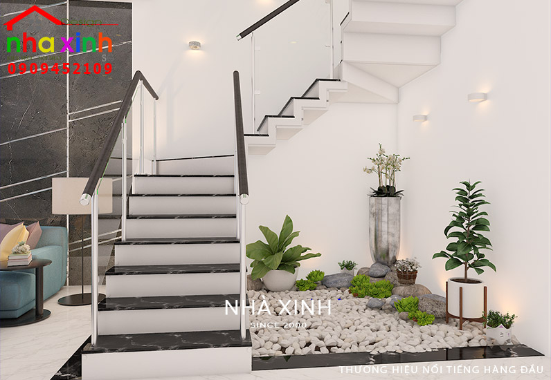 Tiểu cảnh cây xanh trang trí góc cầu thang đem lại thẩm mỹ cao cho mẫu thiết kế nội thất nhà phố đẹp